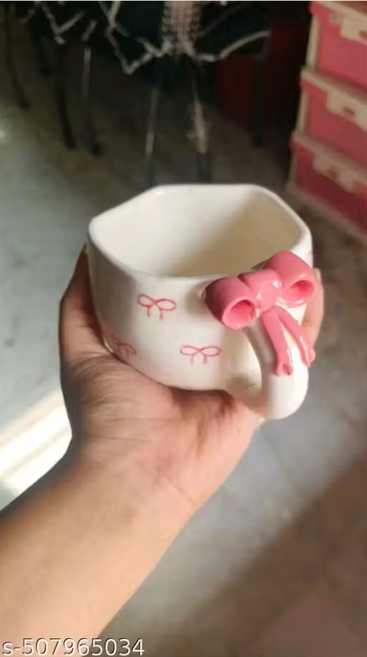 Cute ceramic coffee mug with pink bow design and printed pattern for tea and coffee